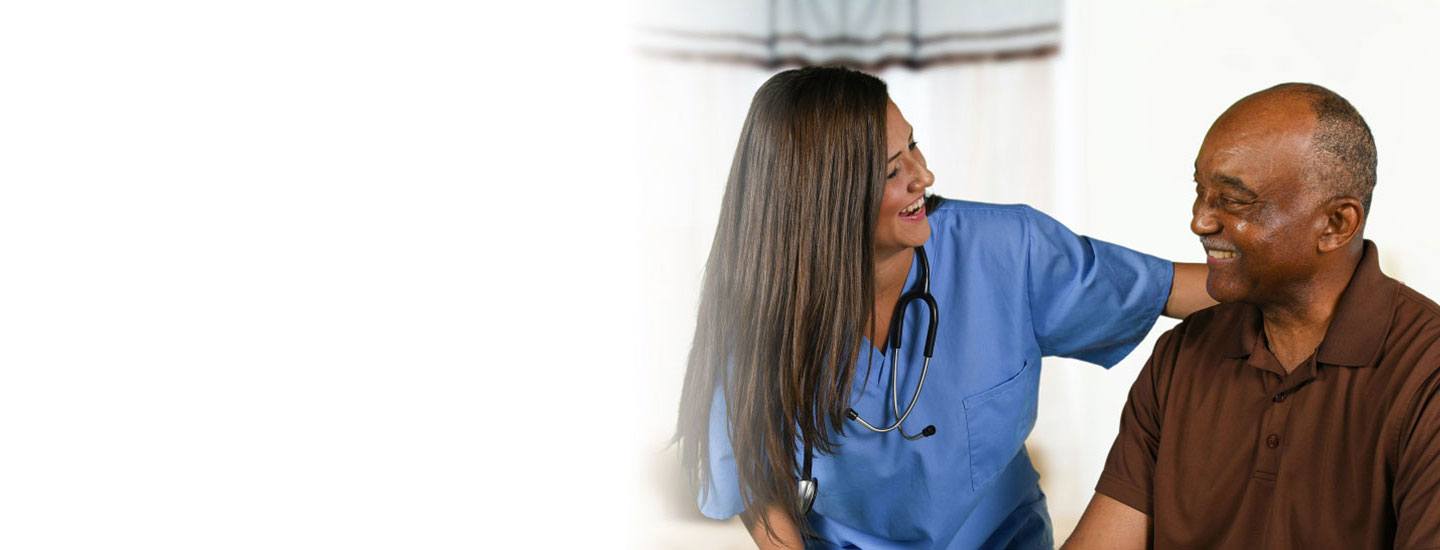 Nurse assists a patient.